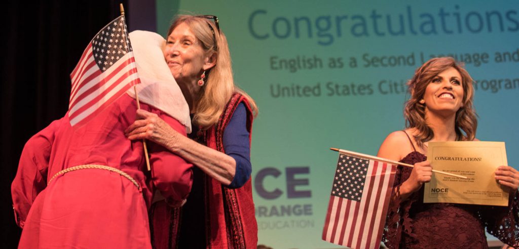 A photo of two students receiving their citizenship certificates at the 2019 Student Success event.