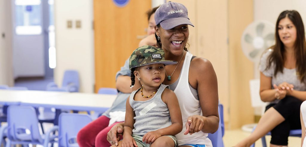 A photo of a mother and son in a parenting class