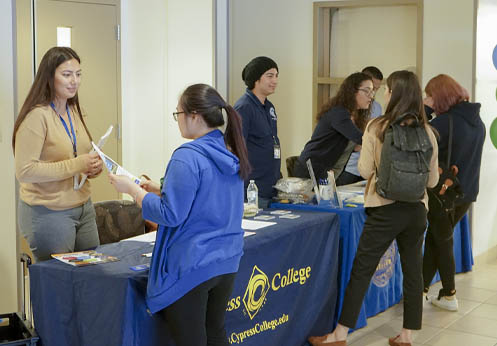 Fullerton College and Cypress College hosting a resource table at NOCE.