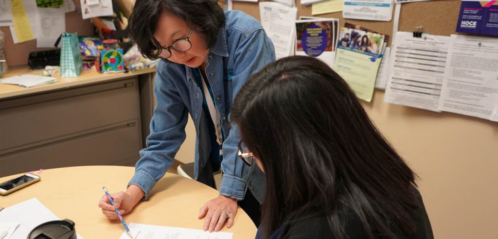 A photo of a NOCE counselor during an appointment with a student