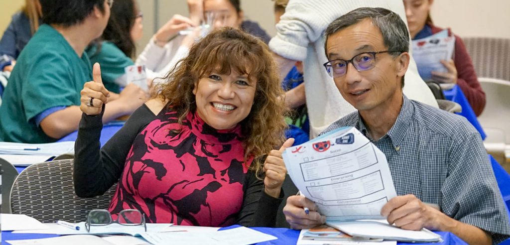 A photo of two smiling students at the student equity conference